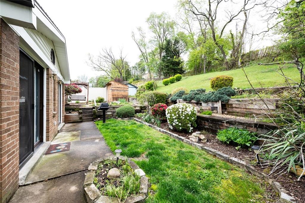 1342 Cathell Road Pittsburgh, PA 15236 - Photo 19 of 31 a view of a garden with a houses