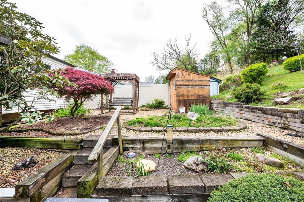 1342 Cathell Road Pittsburgh, PA 15236 - Photo 20 of 31 a view of a house with a yard and large trees