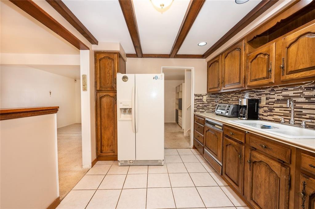 1342 Cathell Road Pittsburgh, PA 15236 - Photo 2 of 31 a kitchen with stainless steel appliances granite countertop a refrigerator and a sink