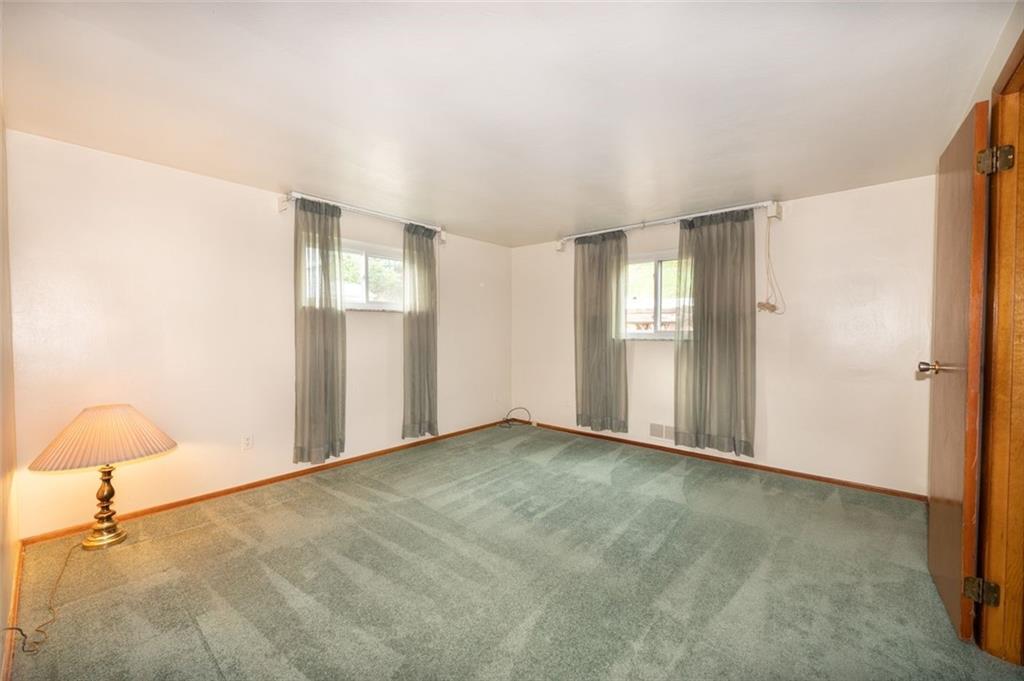 1342 Cathell Road Pittsburgh, PA 15236 - Photo 24 of 31 a view of an empty room with window and chandelier fan