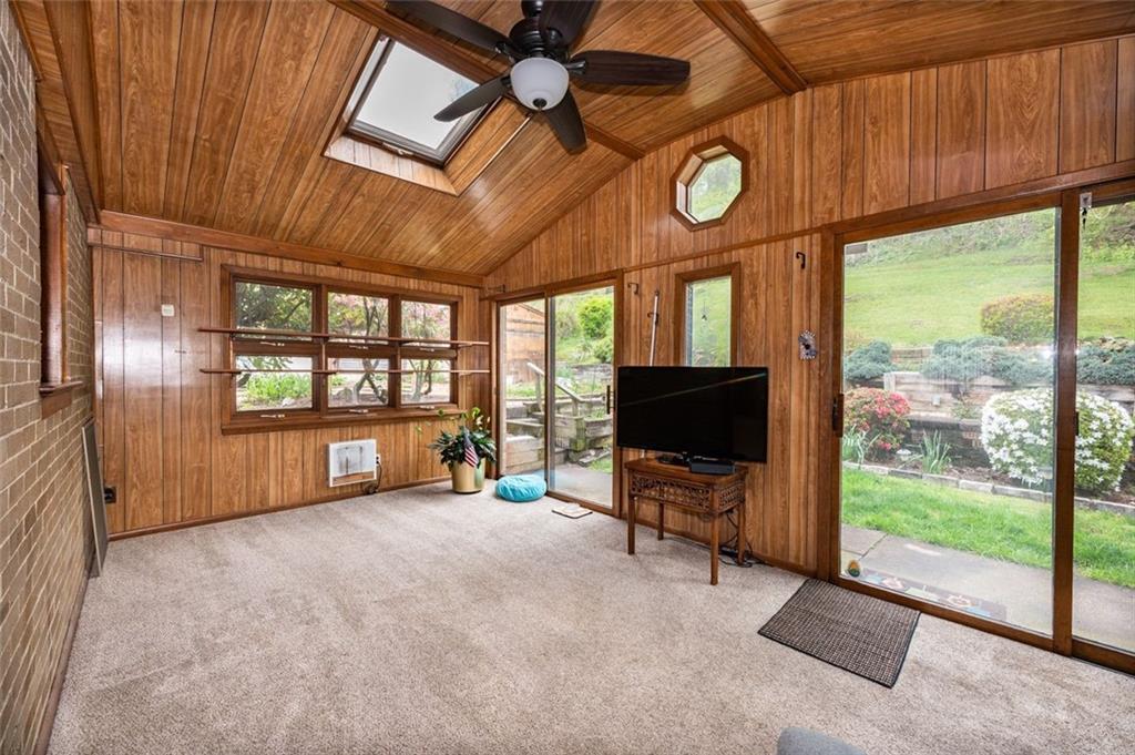 1342 Cathell Road Pittsburgh, PA 15236 - Photo 6 of 31 a view of an empty room with a fireplace and a large window