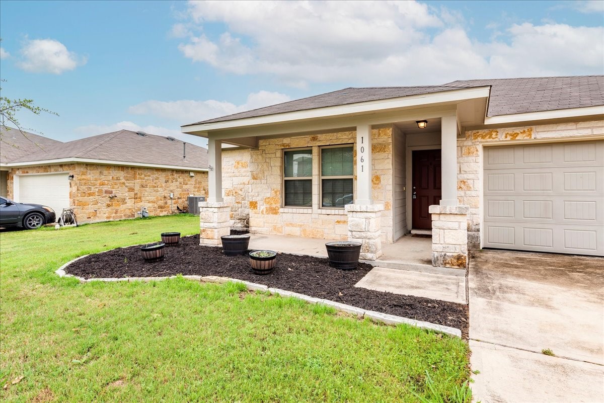 1061 Violet Lane Kyle, TX 78640 - Photo 29 of 34 Entry view of the home showing front covered porch
