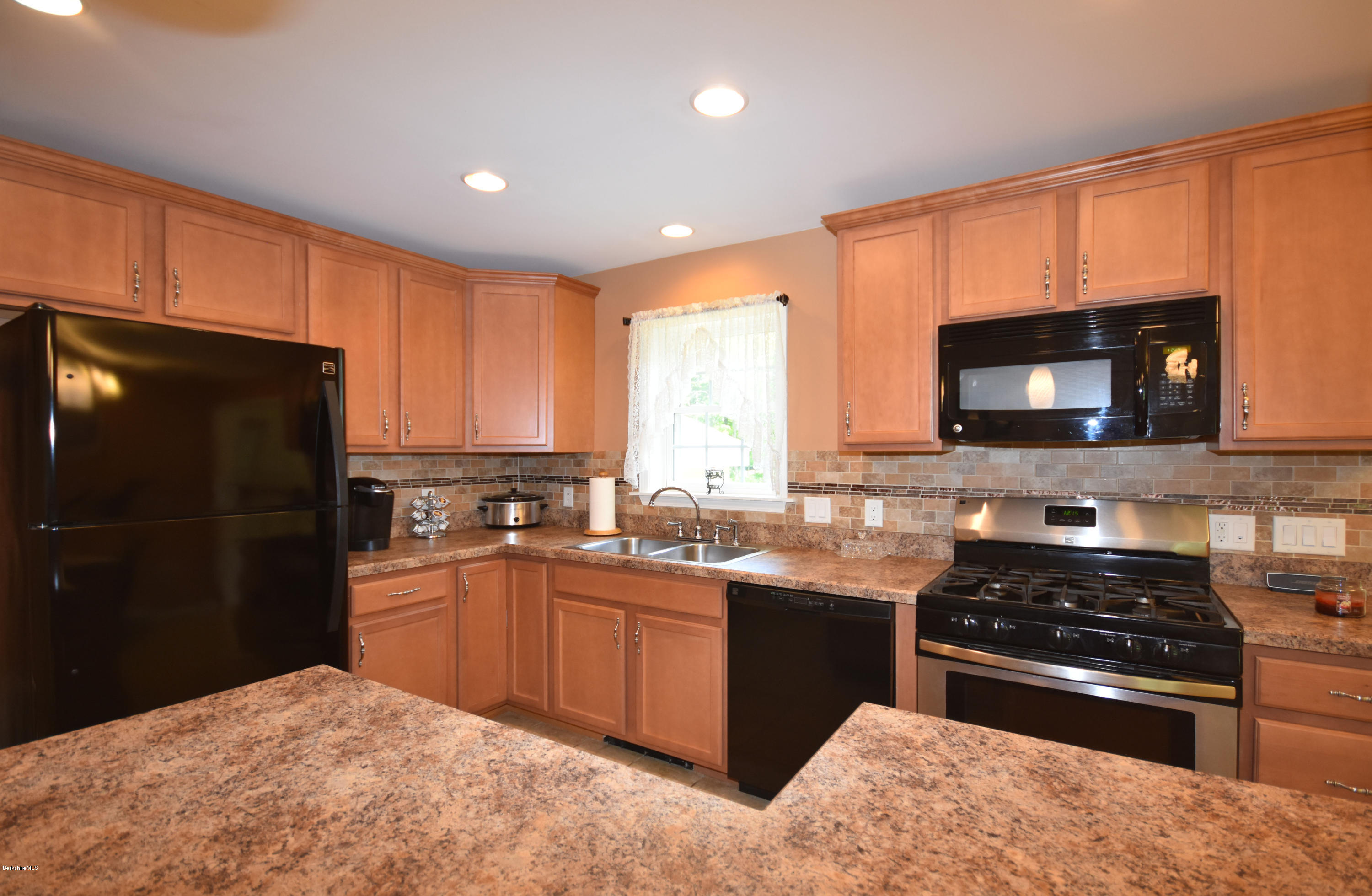 205 Windsor Road Savoy, MA 01256 - Photo 12 of 53 a kitchen with a sink stove and microwave