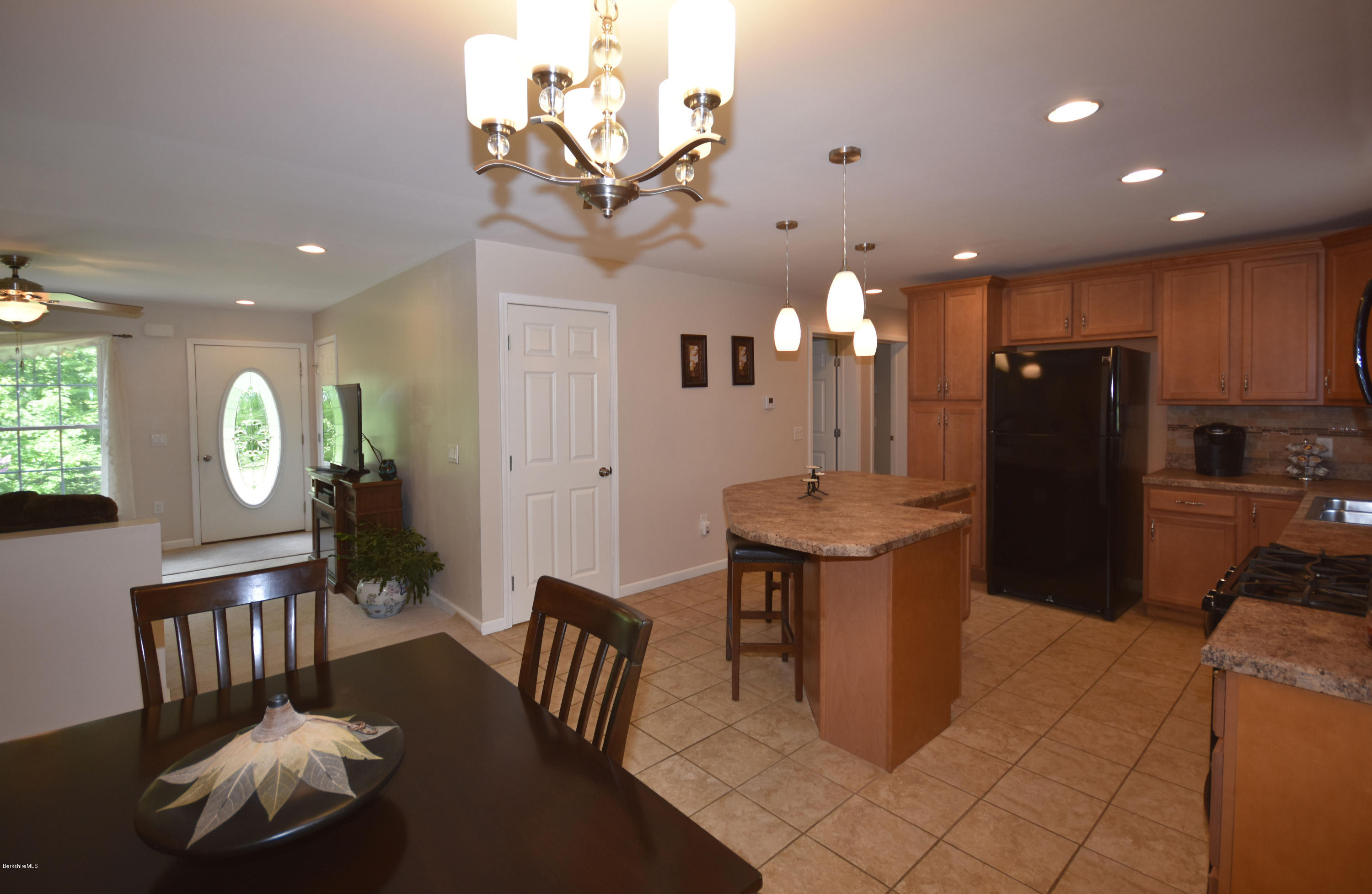 205 Windsor Road Savoy, MA 01256 - Photo 14 of 53 a kitchen with a table and chairs
