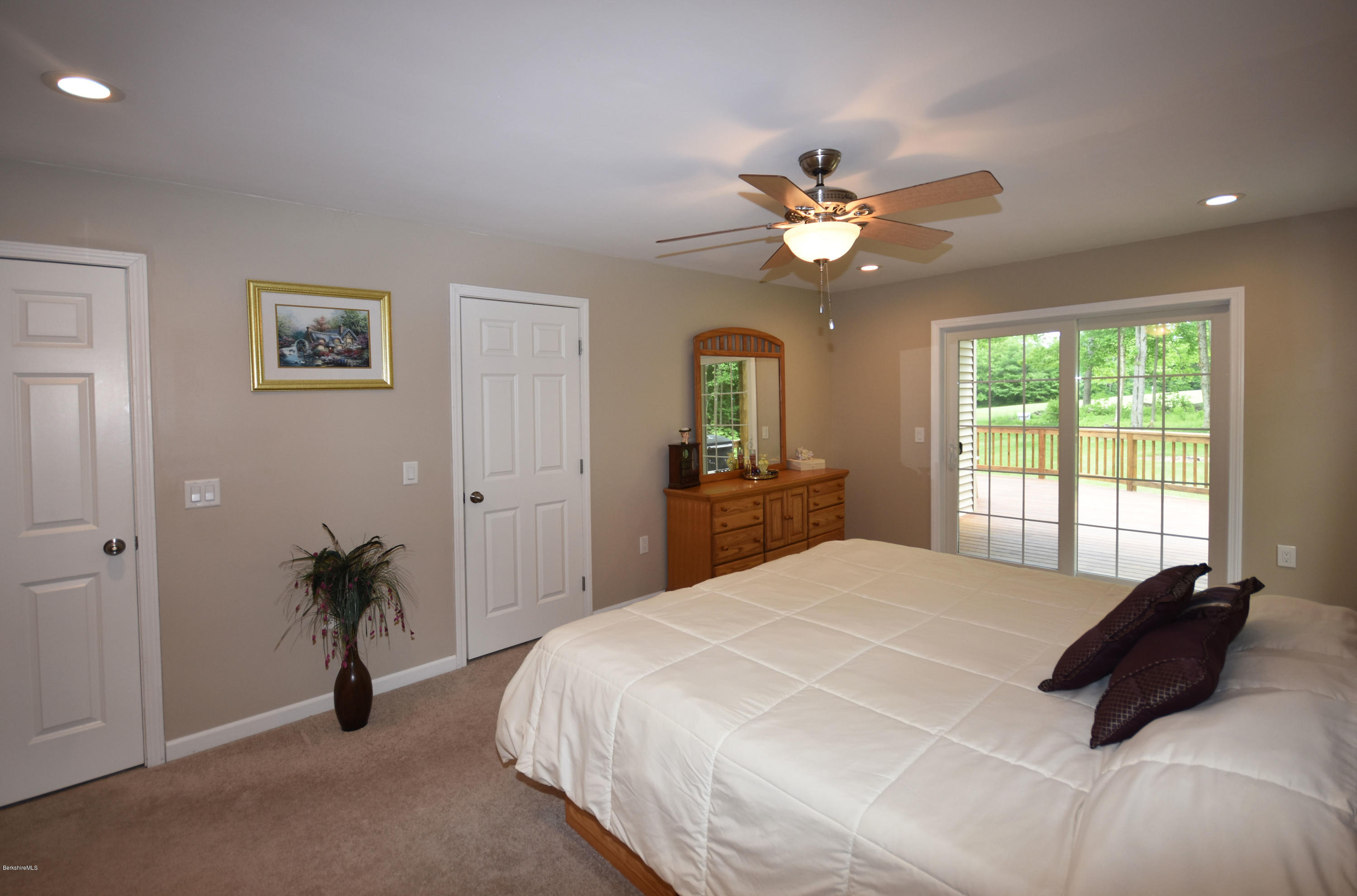 205 Windsor Road Savoy, MA 01256 - Photo 20 of 53 a bedroom with a bed and a chandelier
