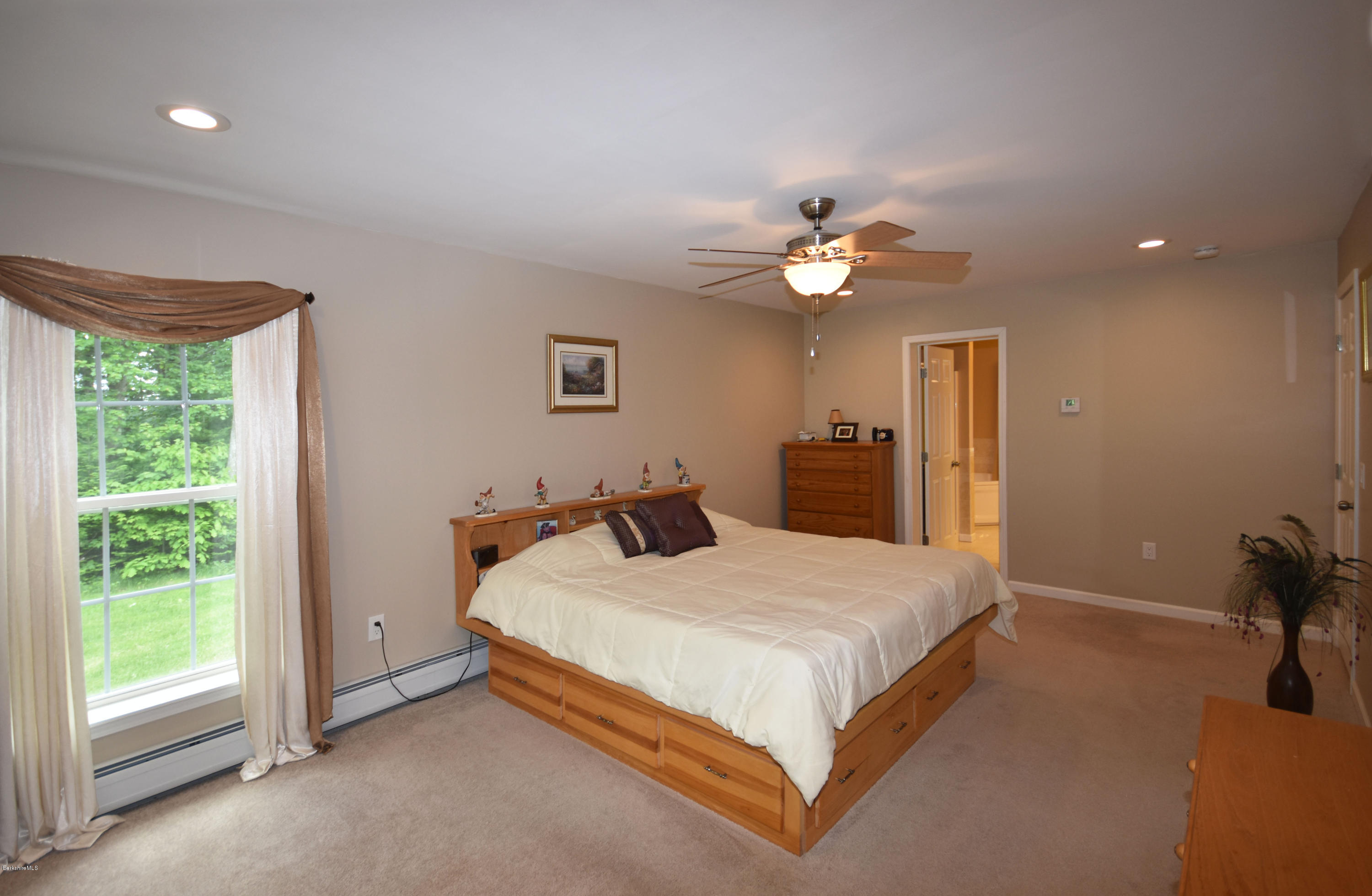 205 Windsor Road Savoy, MA 01256 - Photo 21 of 53 a bedroom with a bed and a chandelier