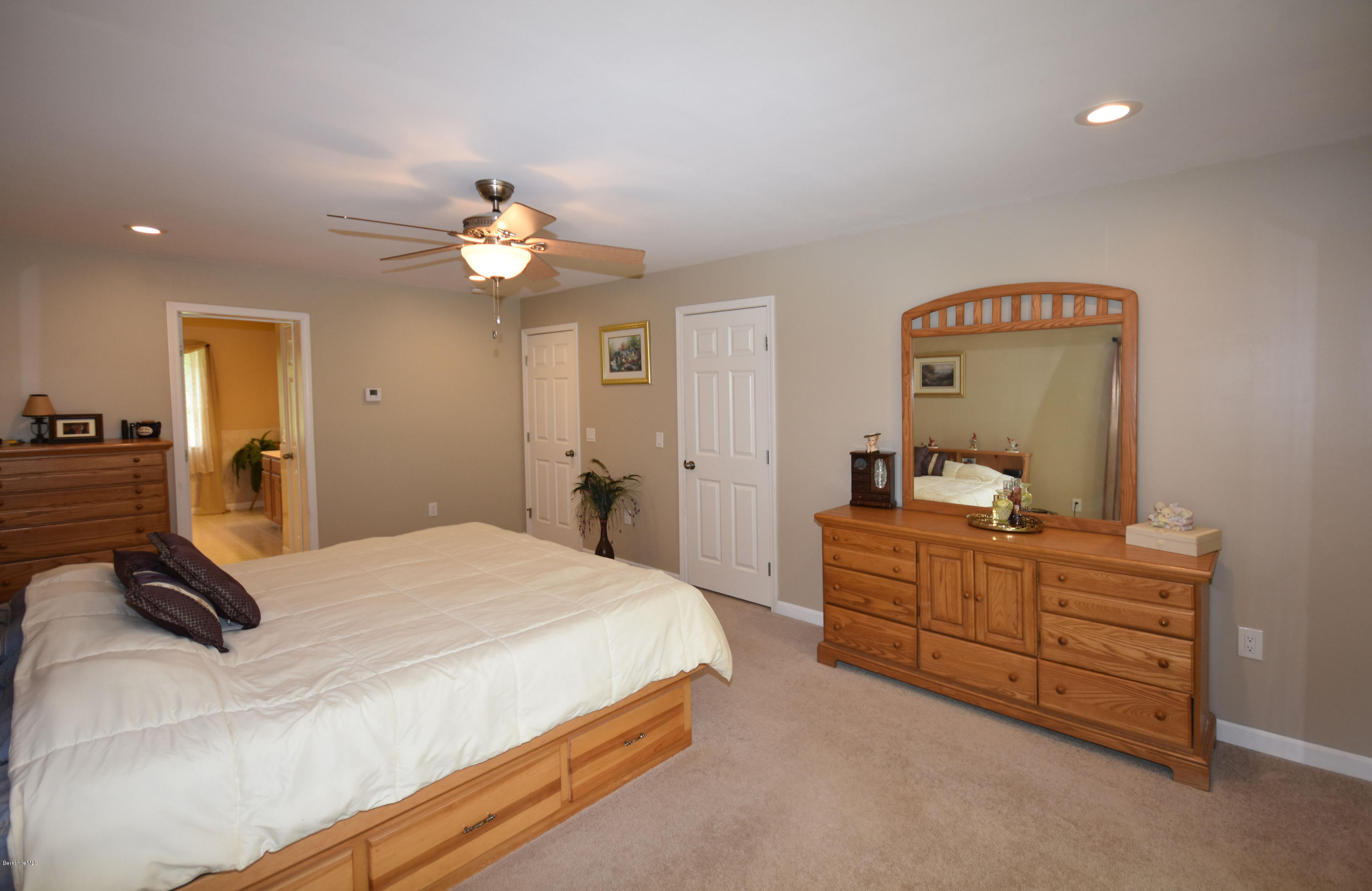 205 Windsor Road Savoy, MA 01256 - Photo 22 of 53 a bedroom with a bed and a chandelier