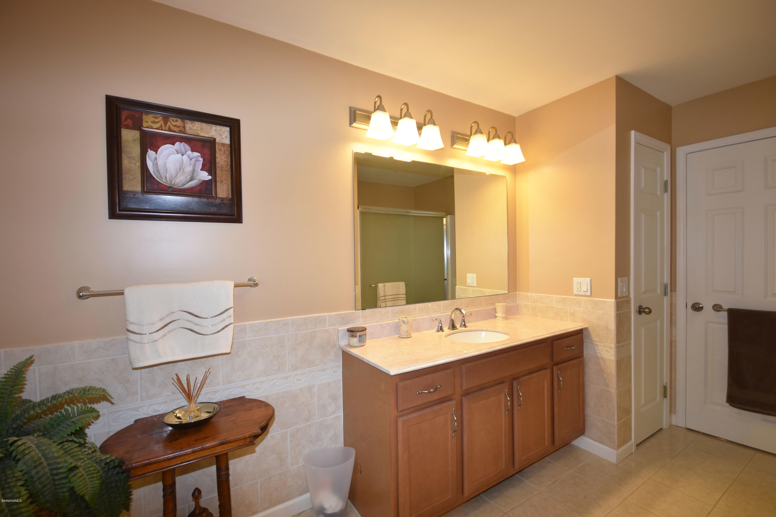 205 Windsor Road Savoy, MA 01256 - Photo 23 of 53 a bathroom with a double vanity sink and a mirror