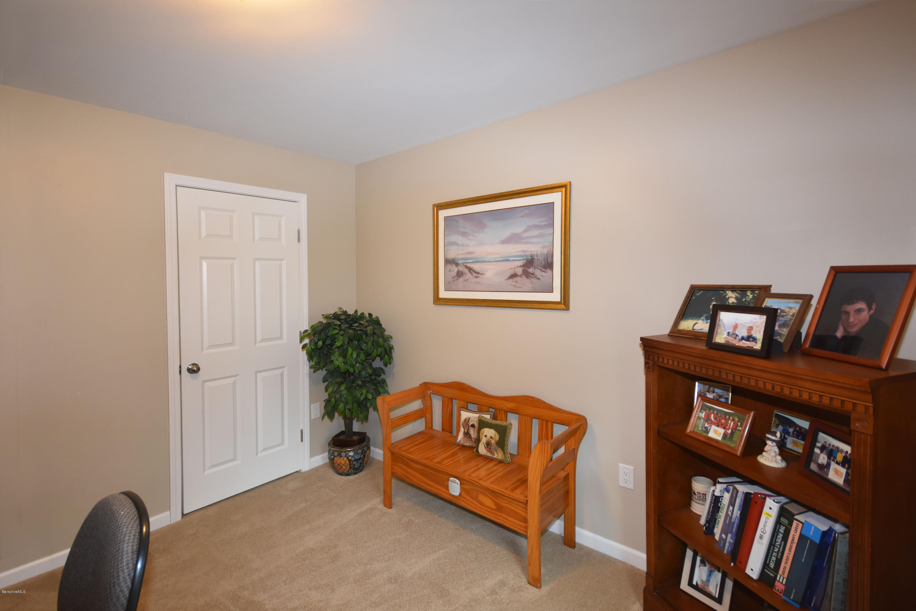 205 Windsor Road Savoy, MA 01256 - Photo 34 of 53 a view of a livingroom with furniture and a book shelf