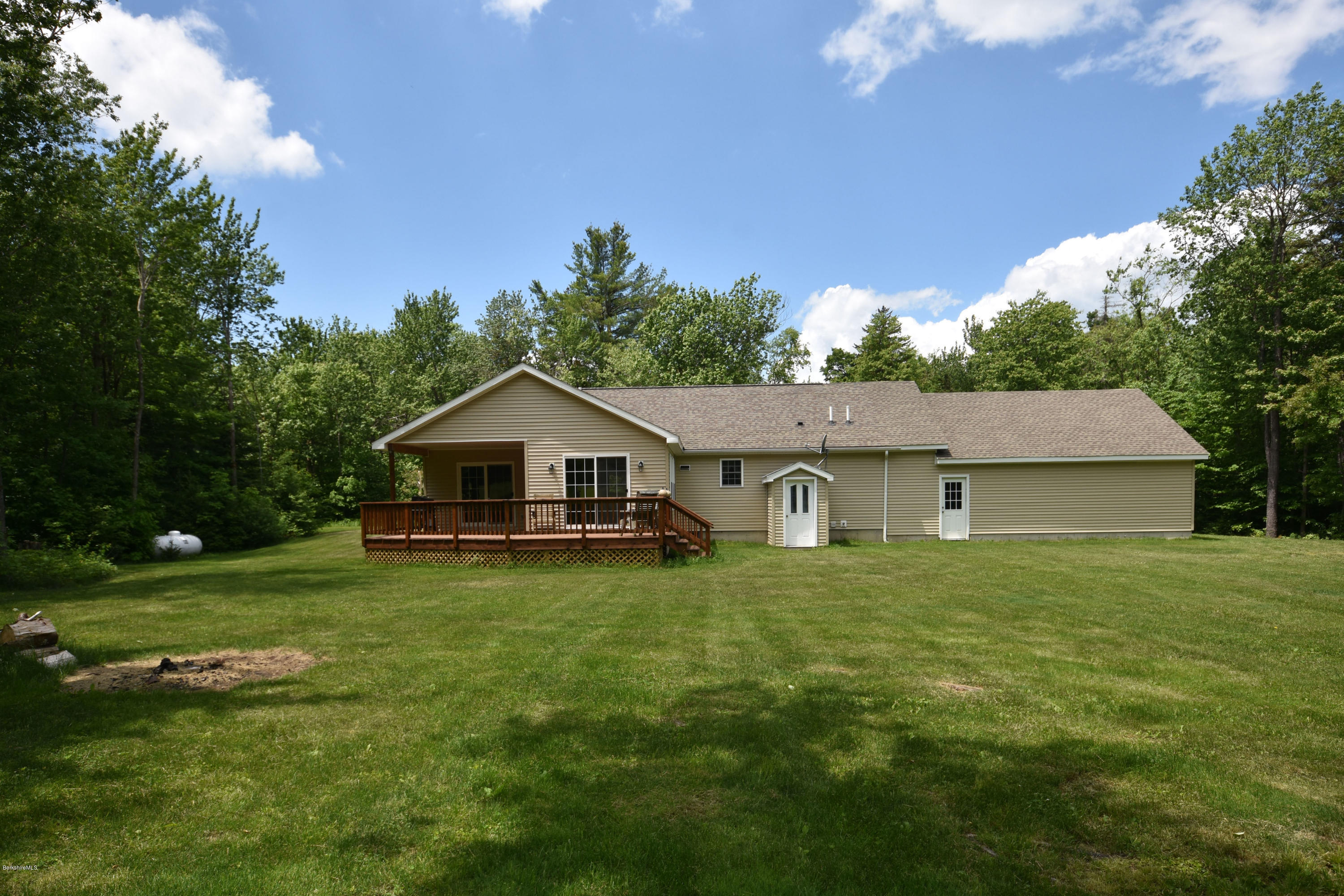 205 Windsor Road Savoy, MA 01256 - Photo 45 of 53 a house with huge green field in front of it