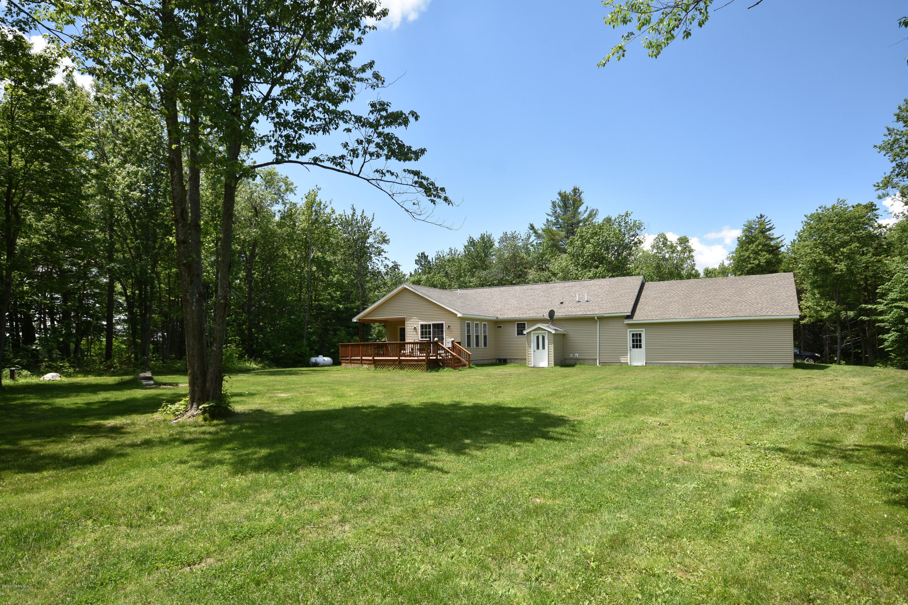 205 Windsor Road Savoy, MA 01256 - Photo 46 of 53 a front view of a house with a yard and trees