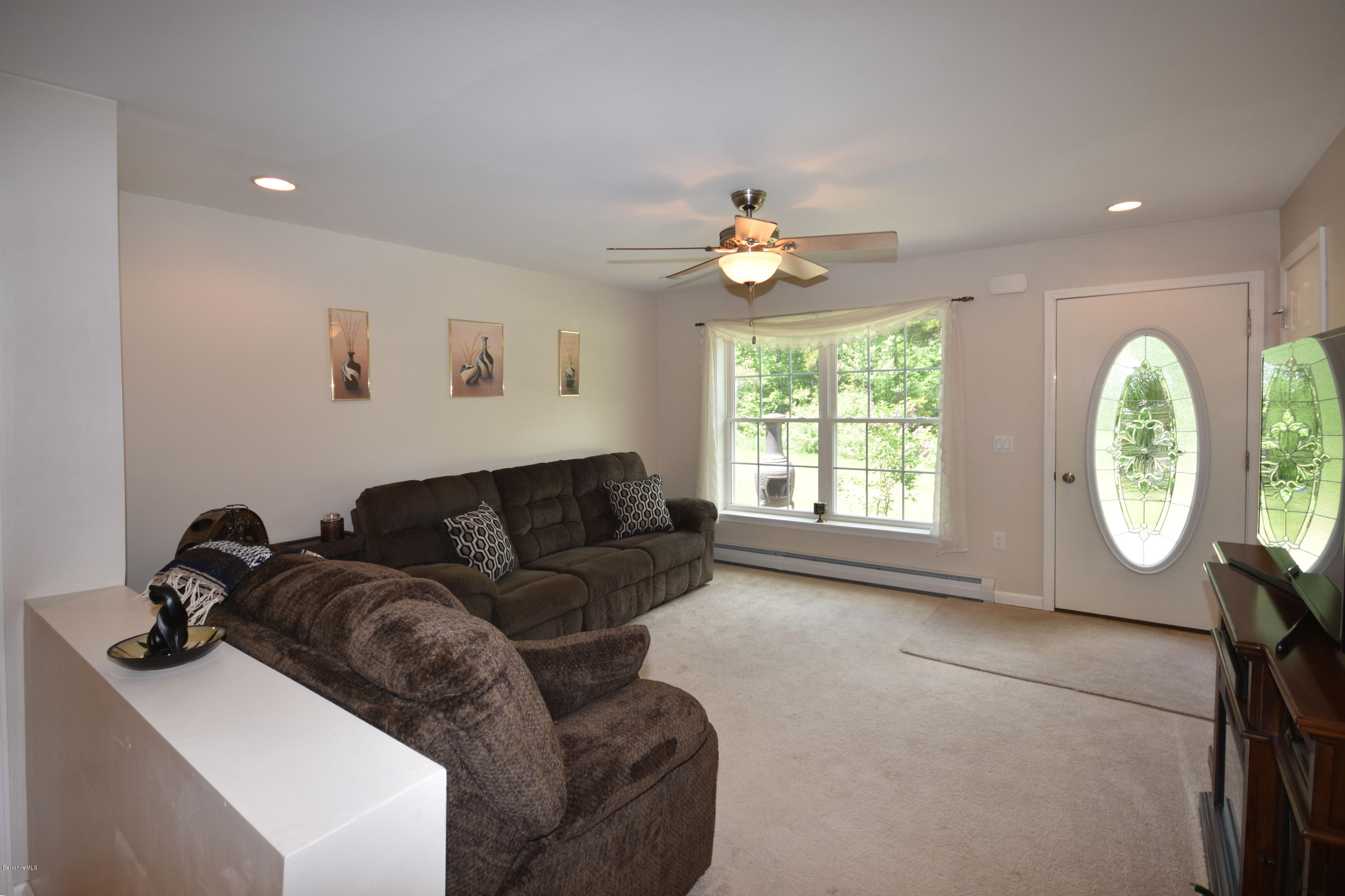 205 Windsor Road Savoy, MA 01256 - Photo 6 of 53 a living room with furniture a window and a chandelier