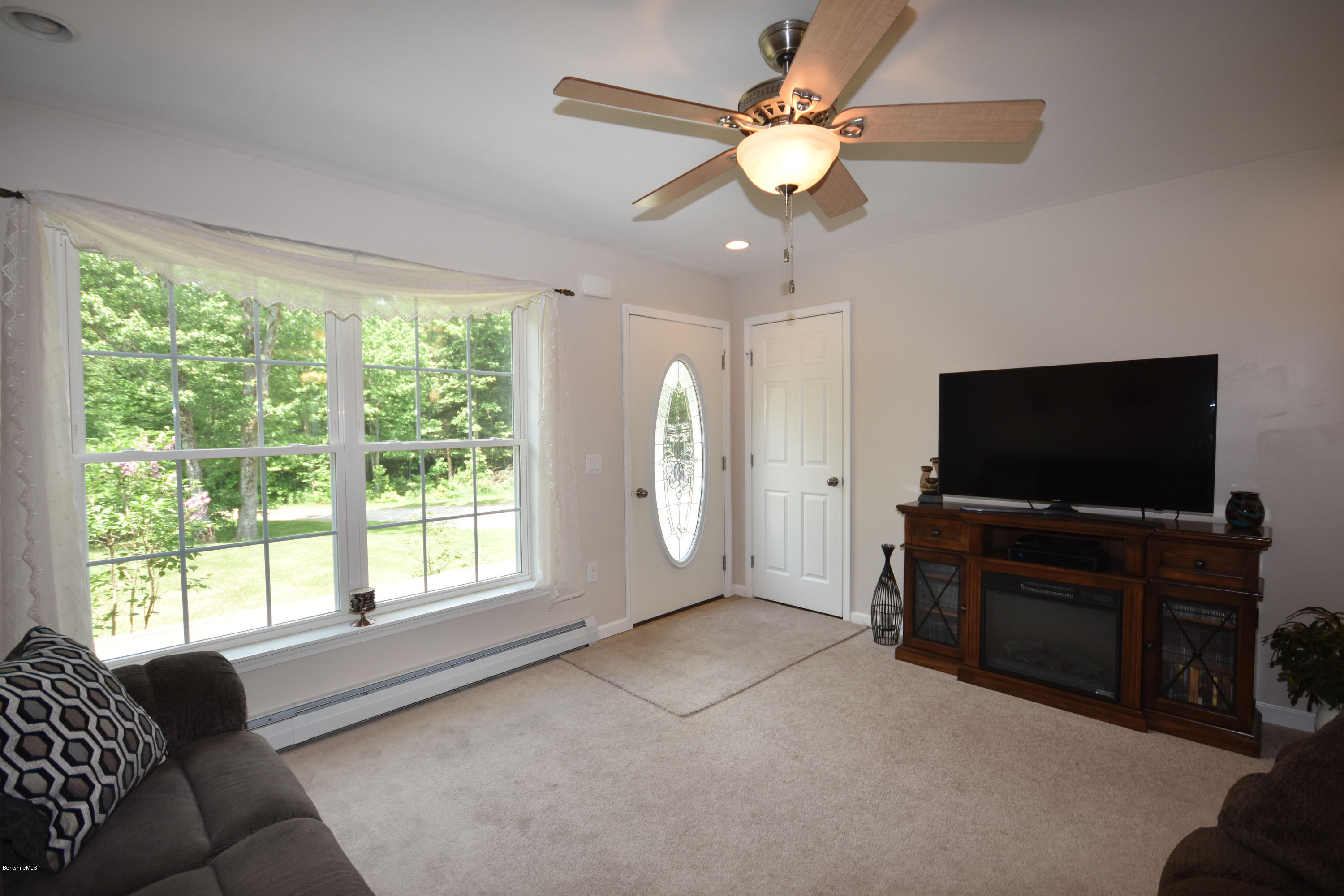 205 Windsor Road Savoy, MA 01256 - Photo 7 of 53 a living room with furniture and a flat screen tv