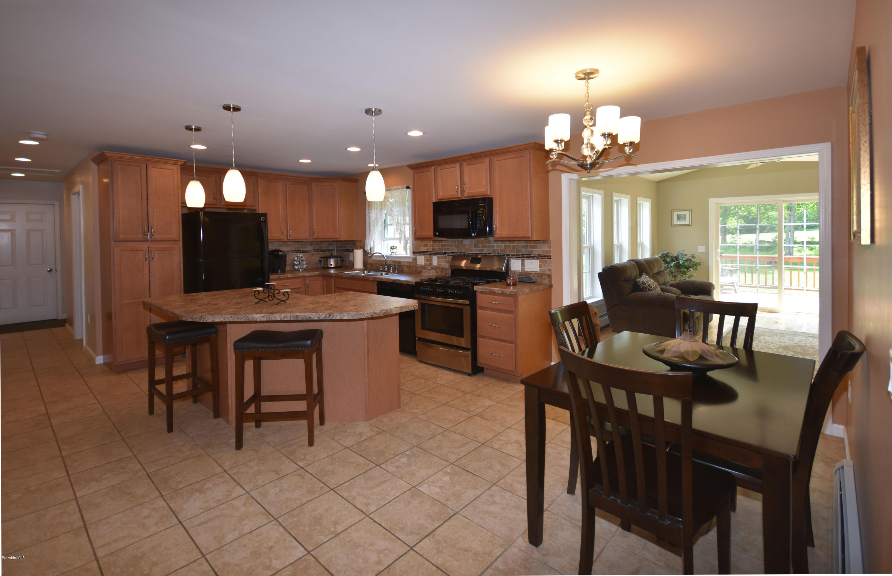 205 Windsor Road Savoy, MA 01256 - Photo 10 of 53 a view of a dining room with furniture and a chandelier