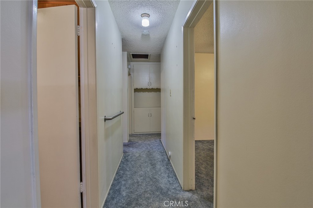 15719 Pitts Avenue Paramount, CA 90723 - Photo 16 of 33 a view of hallway with wooden floor
