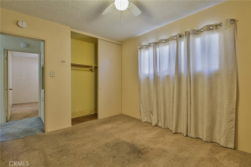 15719 Pitts Avenue Paramount, CA 90723 - Photo 18 of 33 a view of a bathroom with shower and a chandelier fan