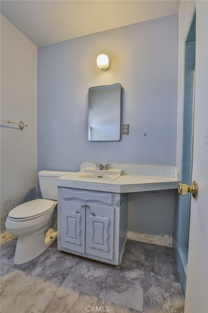 15719 Pitts Avenue Paramount, CA 90723 - Photo 22 of 33 a bathroom with a sink and a toilet