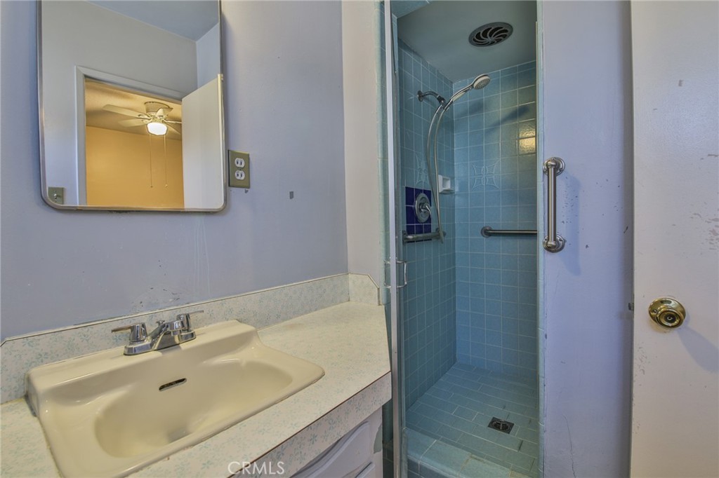 15719 Pitts Avenue Paramount, CA 90723 - Photo 23 of 33 a bathroom with a sink shower and a mirror