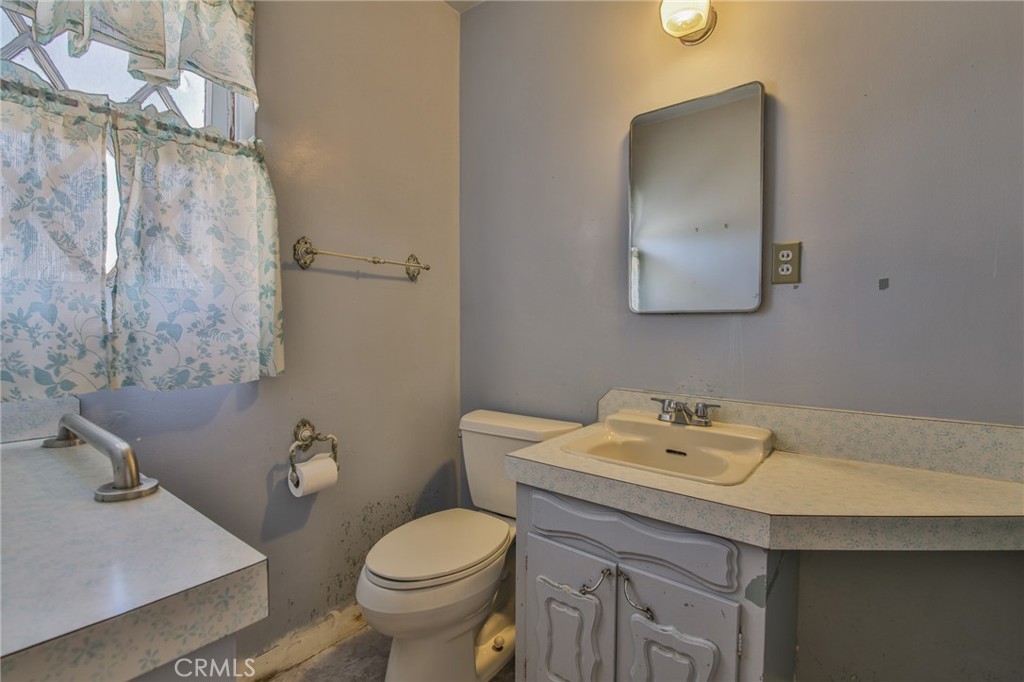 15719 Pitts Avenue Paramount, CA 90723 - Photo 24 of 33 a bathroom with a sink and a toilet