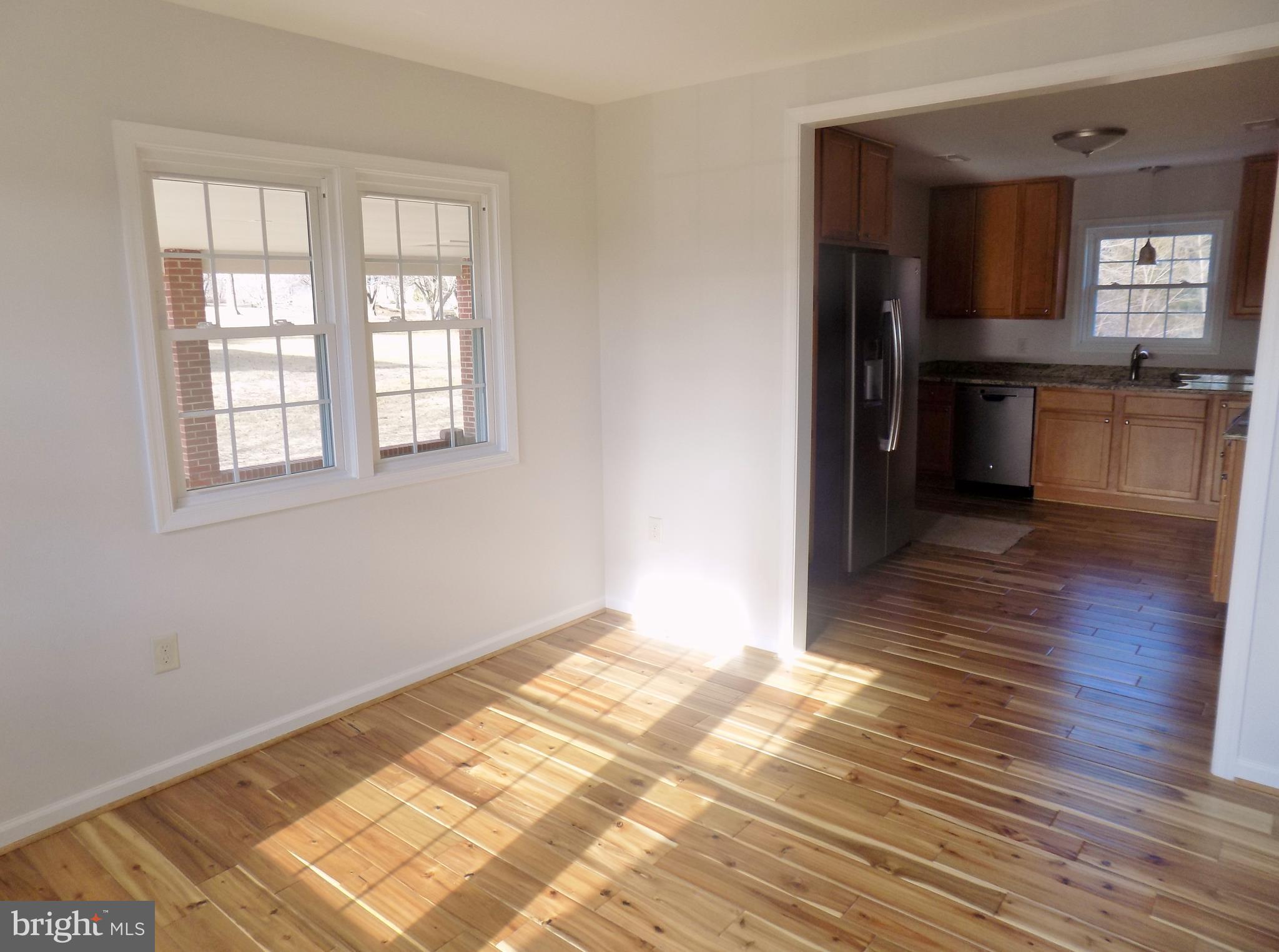 592 Apple Valley Road Winchester, VA 22602 - Photo 13 of 30 Smooth transition into the sunny dining area.