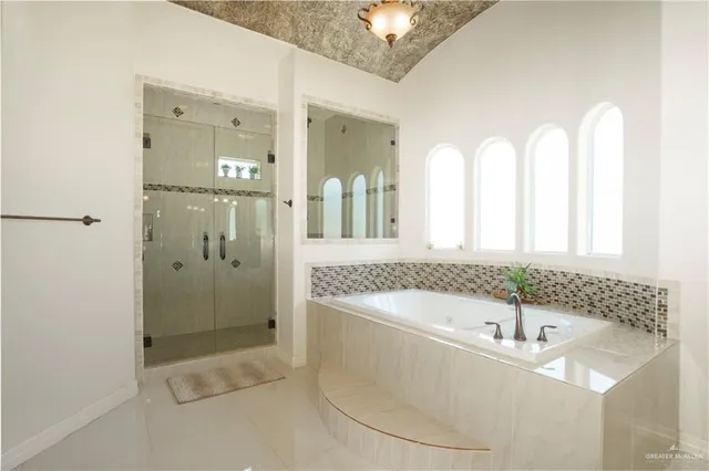 a bathroom with a bathtub and a sink