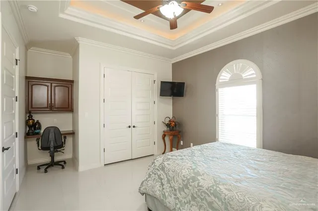 a bedroom with a bed and a chair