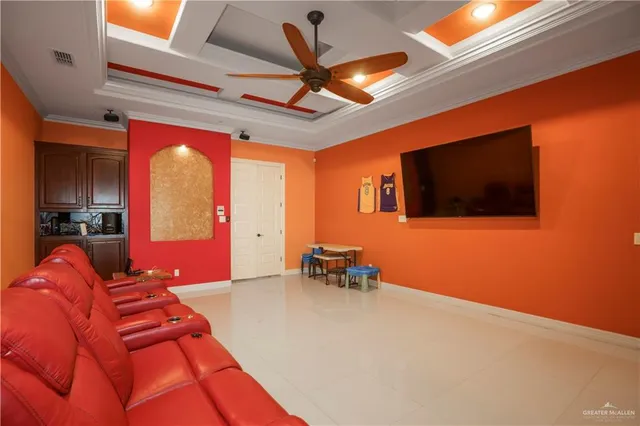 a bedroom with furniture and a flat screen tv