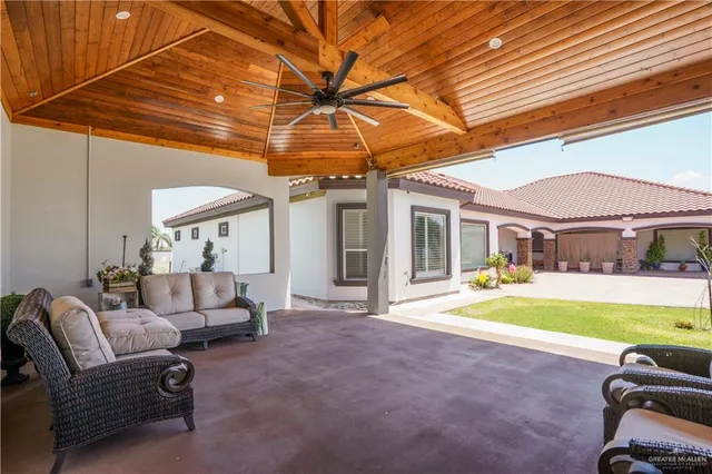 a view of a patio with swimming pool table and chairs