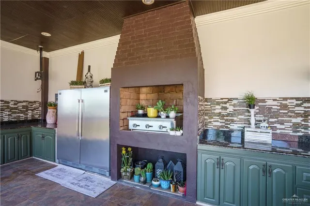 a kitchen with a refrigerator and countertop