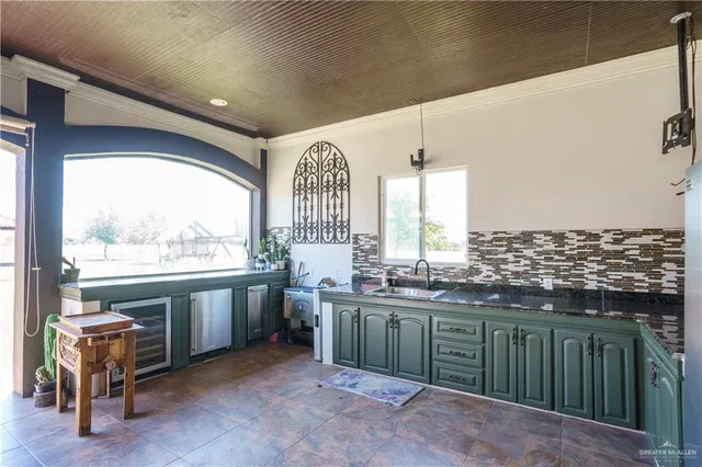 a kitchen with a sink and cabinets