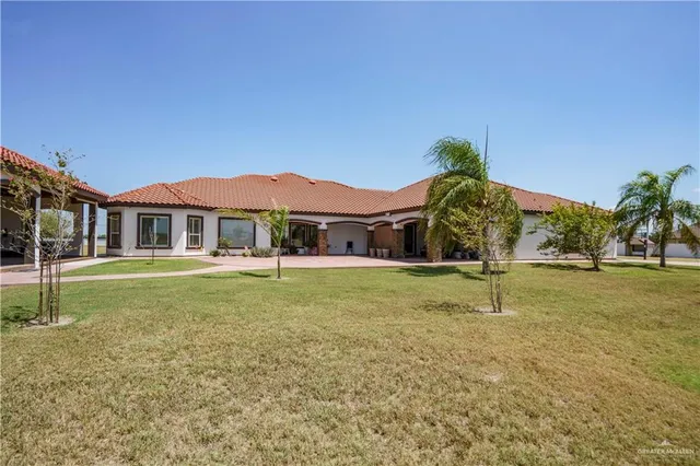 a view of a house with a yard