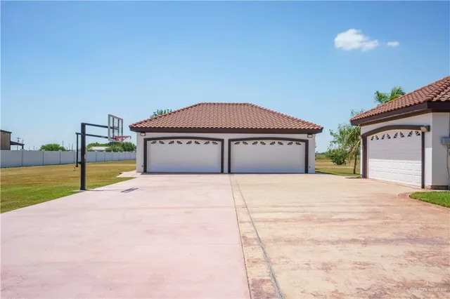 a house with yard and a car parked