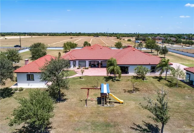 an outdoor space with pool and furniture
