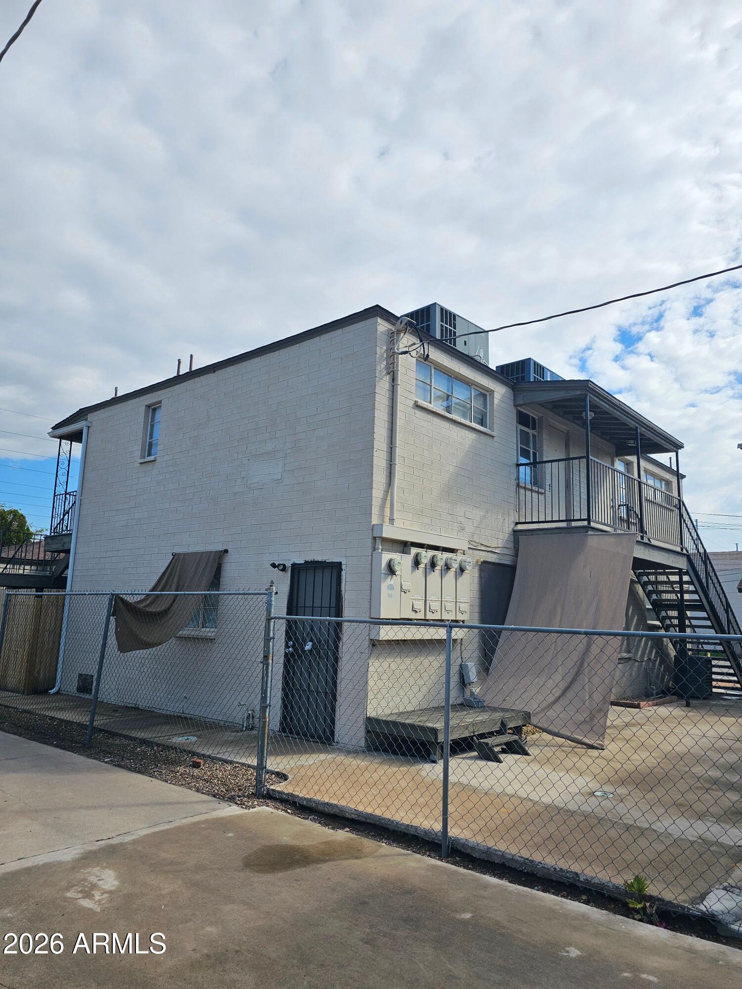 1517 West Thomas Road, Unit 3 Phoenix, AZ 85015 - Photo 13 of 14 a house with yard in front of it
