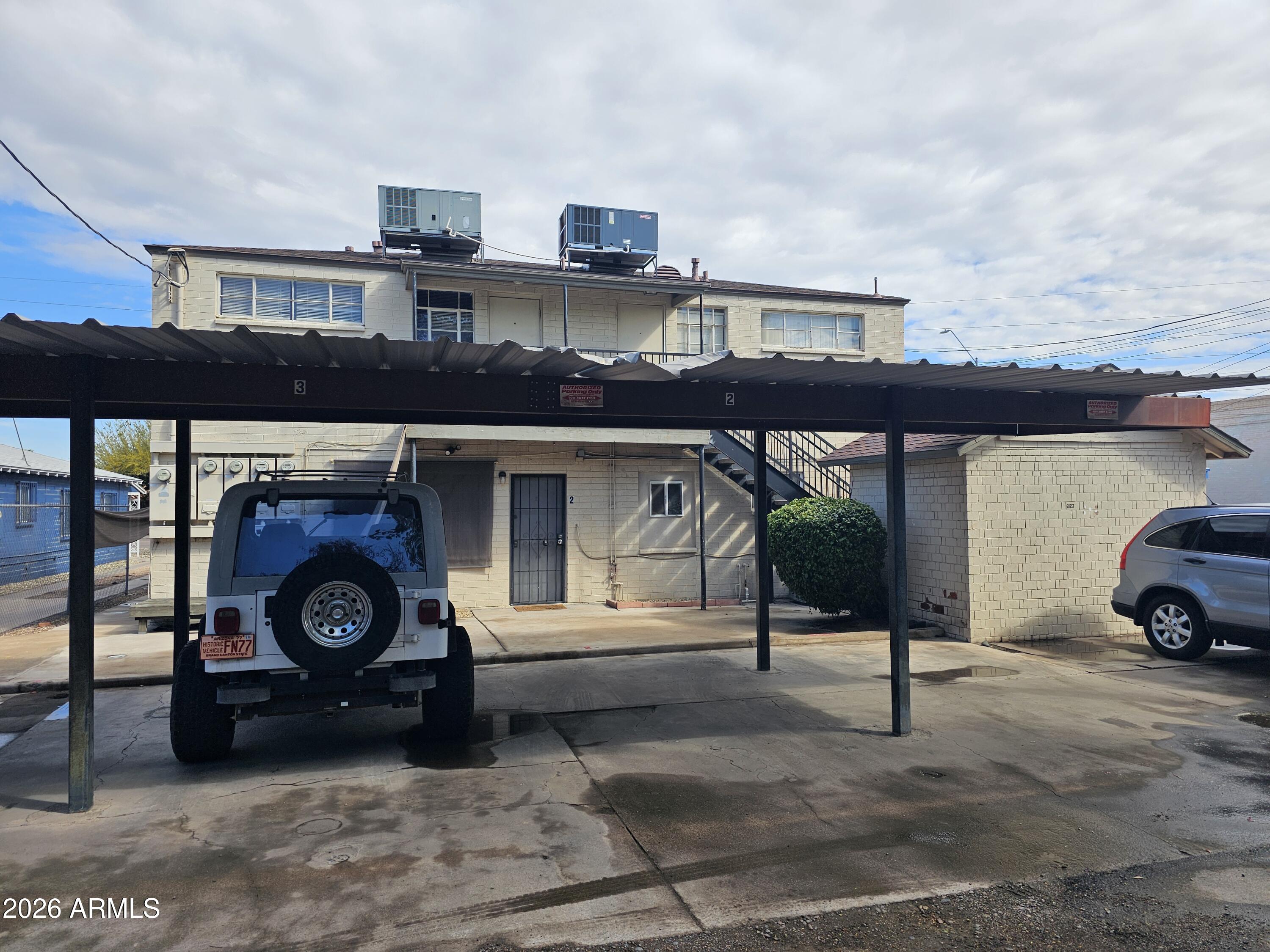 1517 West Thomas Road, Unit 3 Phoenix, AZ 85015 - Photo 14 of 14 a view of car parked in garage