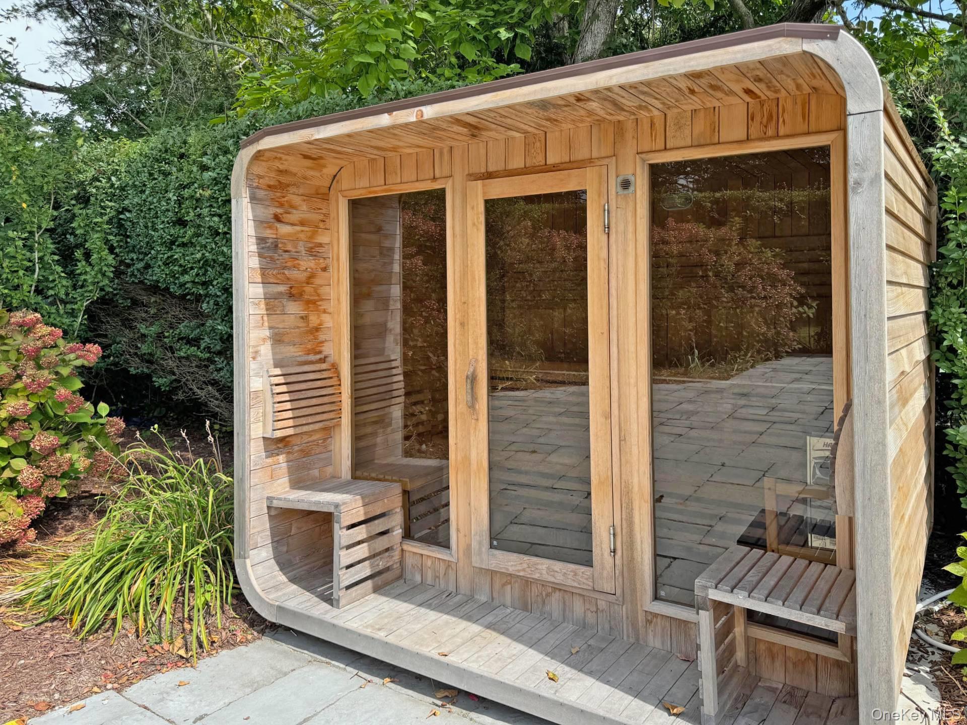 4 Sandacres Road Quogue, NY 11959 - Photo 11 of 32 a front view of a house with a yard