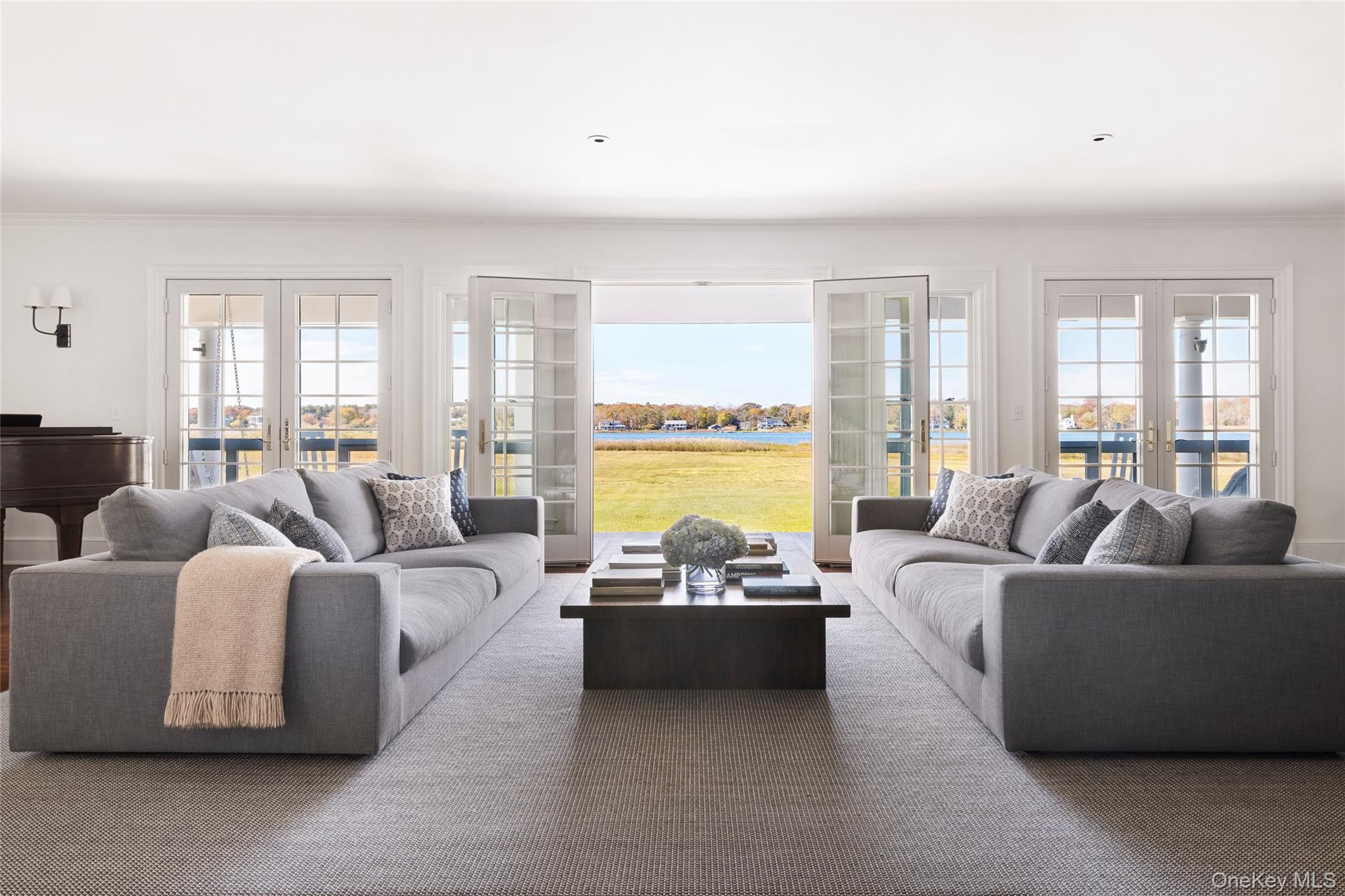 4 Sandacres Road Quogue, NY 11959 - Photo 12 of 32 a living room with furniture and a large window