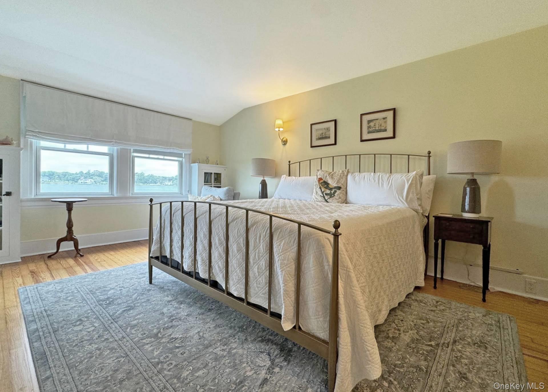 4 Sandacres Road Quogue, NY 11959 - Photo 17 of 32 a bedroom with furniture and a wooden floor
