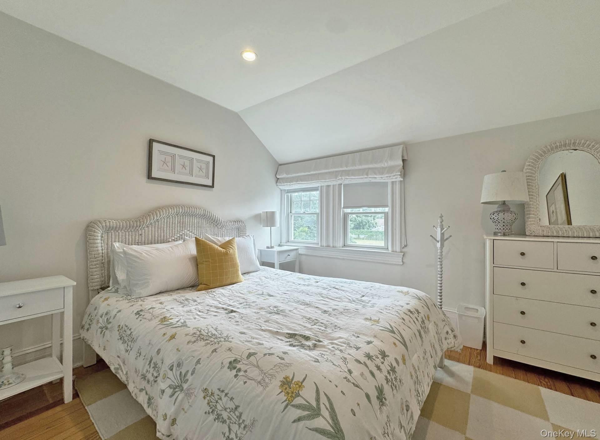 4 Sandacres Road Quogue, NY 11959 - Photo 21 of 32 a large bed sitting in a bedroom and a dresser