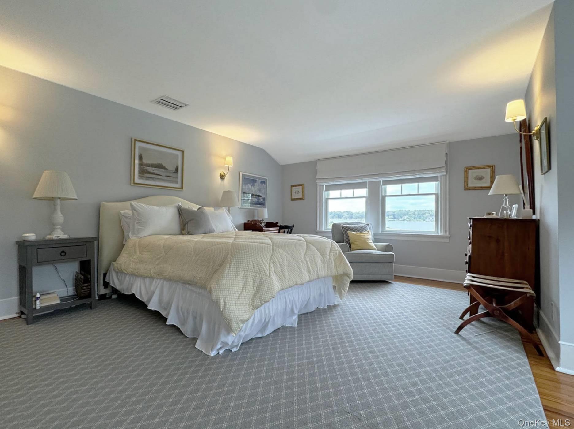 4 Sandacres Road Quogue, NY 11959 - Photo 22 of 32 a bedroom with a bed and a window