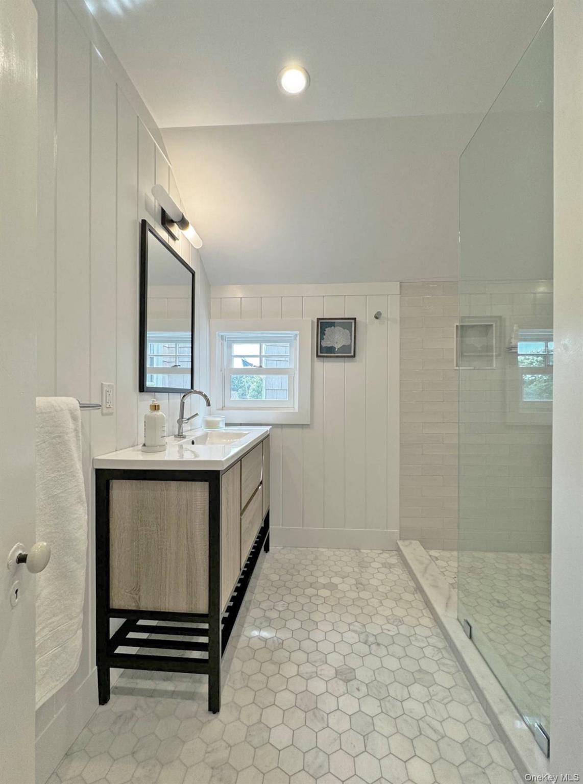 4 Sandacres Road Quogue, NY 11959 - Photo 31 of 32 a bathroom with a sink a toilet and shower