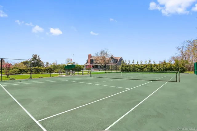 a view of an outdoor space and tennis court