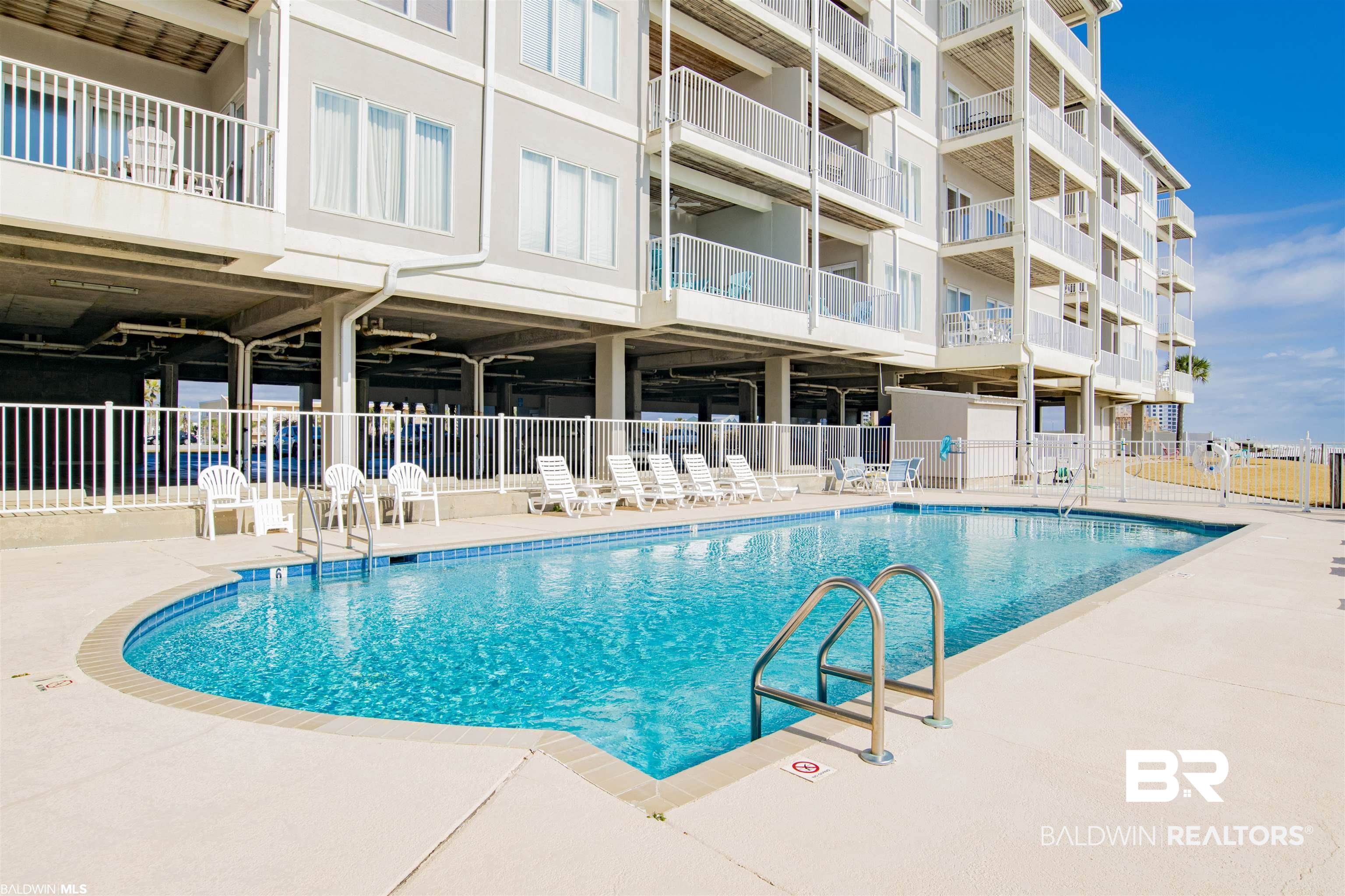 28910 Perdido Beach Boulevard, Unit 4B Orange Beach, AL 36561 - Photo 41 of 48 Pool featuring fence and a patio