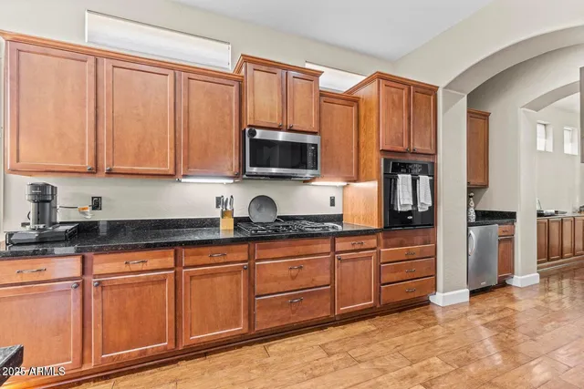 a living room with furniture or wooden floor and a fireplace