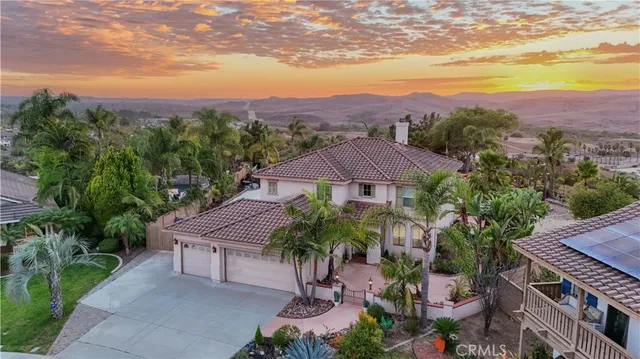aerial view of a house with a garden