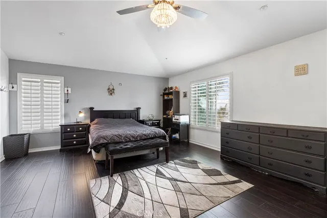 a bedroom with a bed dresser and a window