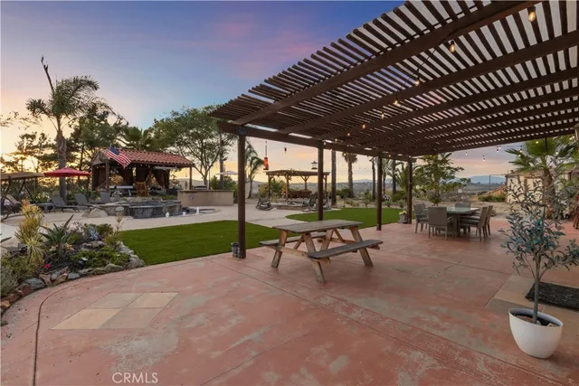 a view of a backyard with sitting area