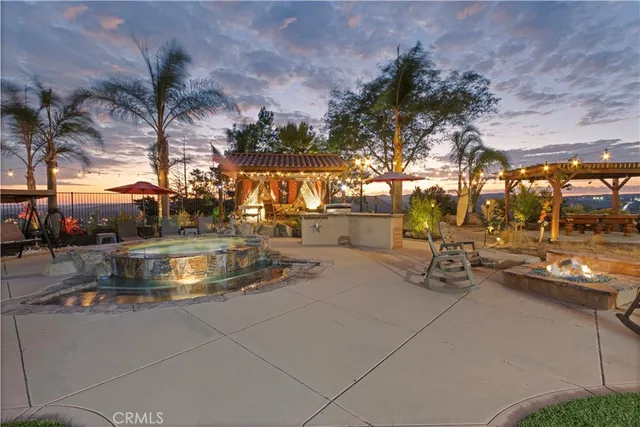 a view of a backyard with sitting area