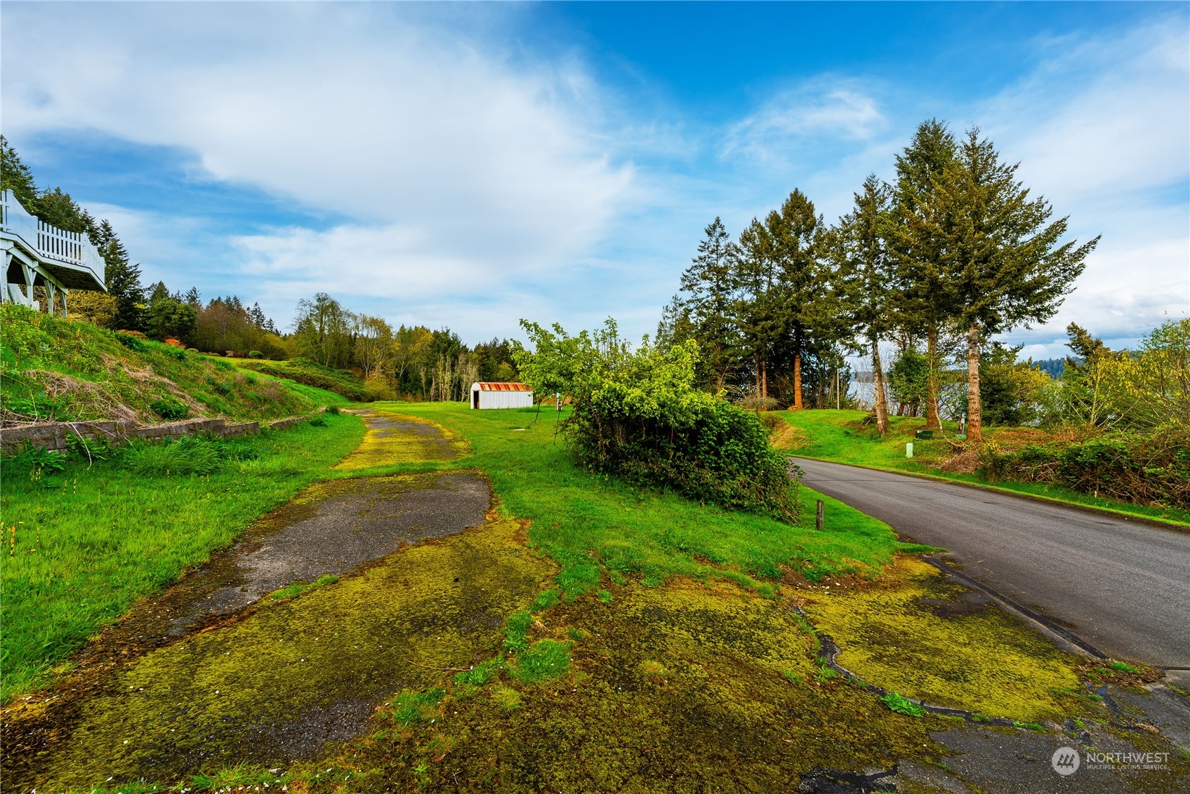 9214 163rd Avenue Southwest Longbranch, WA 98351 - Photo 14 of 31 a view of a street with a big yard