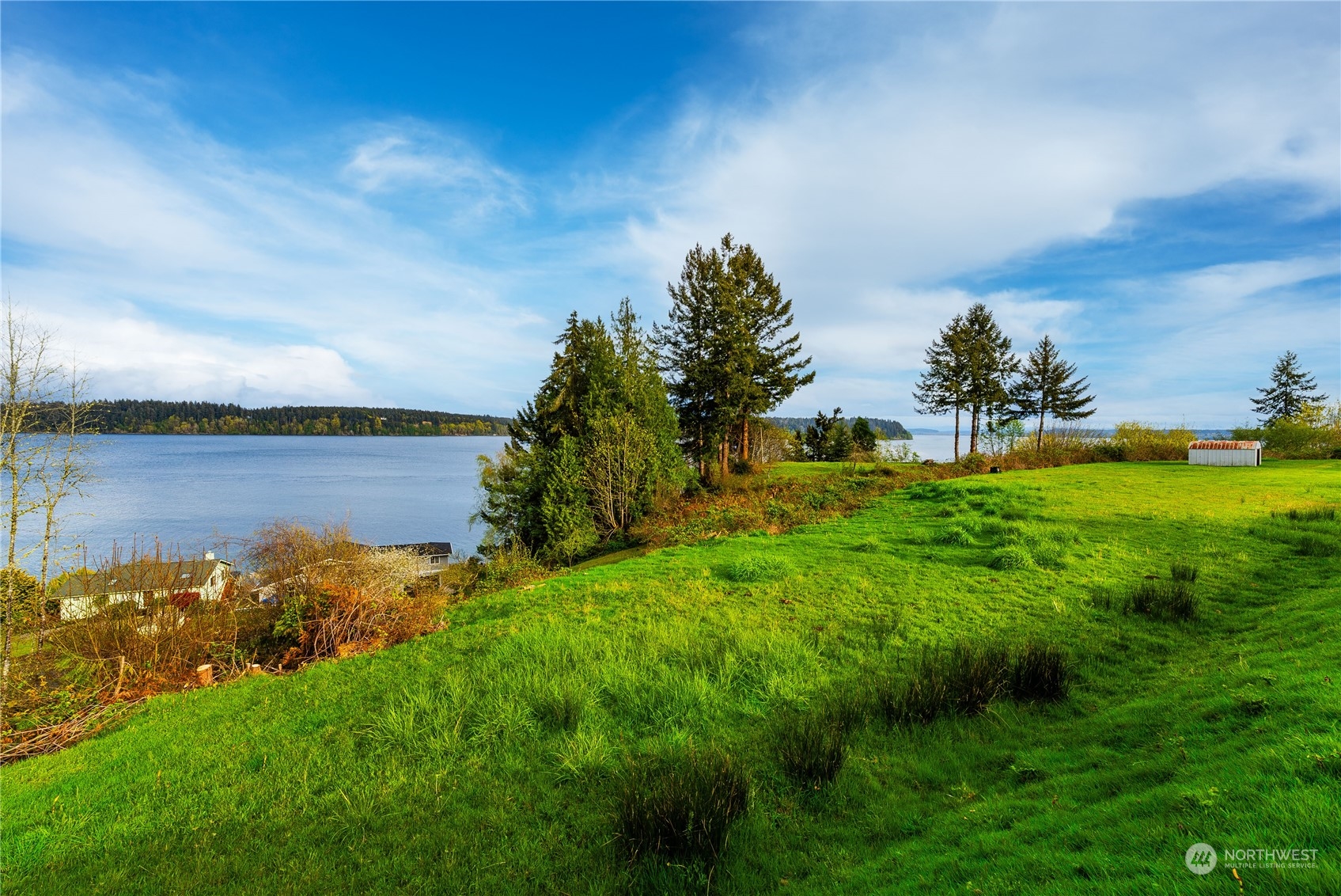 9214 163rd Avenue Southwest Longbranch, WA 98351 - Photo 17 of 31 a view of a lake with a big yard